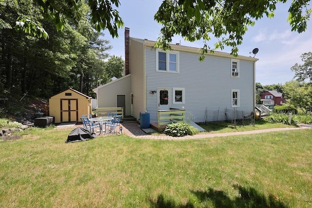 439 S St Unit A, Plainville, MA 02762 - back of house featuring a chimney, a storage shed, a lawn, and a patio area