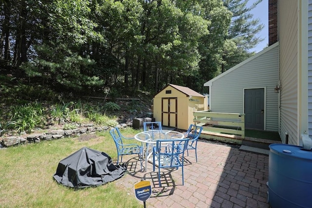 439 S St Unit A, Plainville, MA 02762 - view of patio with a storage shed and outdoor dining space