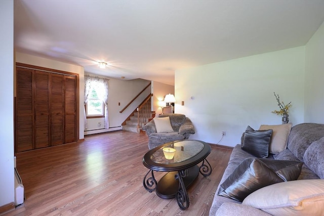 439 S St Unit A, Plainville, MA 02762 - living room with stairway, wood finished floors, and baseboard heating