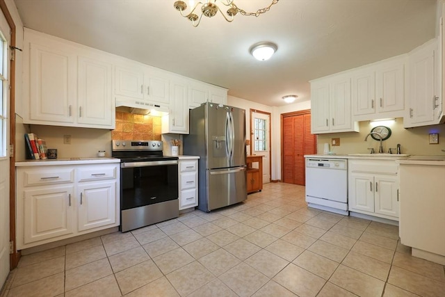 439 S St Unit A, Plainville, MA 02762 - kitchen featuring appliances with stainless steel finishes, under cabinet range hood, light countertops, and white cabinets