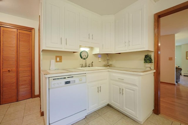 439 S St Unit A, Plainville, MA 02762 - kitchen featuring dishwasher, white cabinets, light countertops, and light tile patterned floors