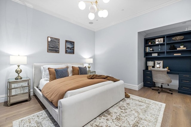 bedroom with crown molding, a chandelier, and light wood-type flooring