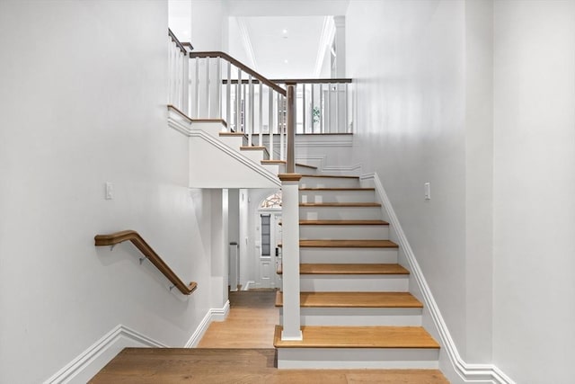 stairway featuring hardwood / wood-style floors