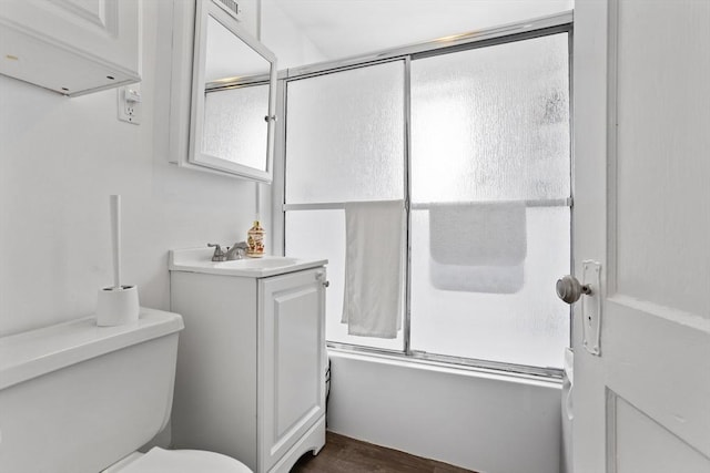 28 Gardner St, Arlington, MA 02474 - bathroom with enclosed tub / shower combo, vanity, toilet, and wood finished floors