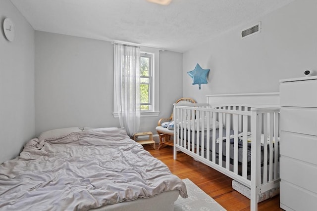 28 Gardner St, Arlington, MA 02474 - bedroom featuring wood finished floors