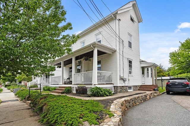 28 Gardner St, Arlington, MA 02474 - view of front of home with a porch