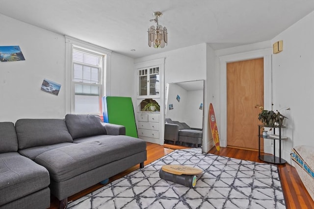 28 Gardner St, Arlington, MA 02474 - living room featuring light wood-type flooring and a chandelier