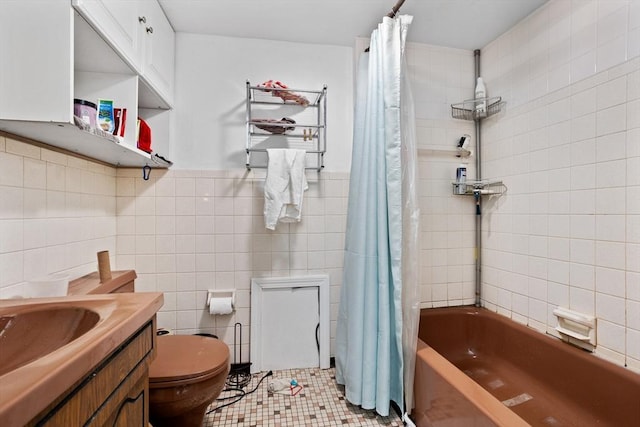 28 Gardner St, Arlington, MA 02474 - full bath featuring tile walls, shower / bathtub combination with curtain, toilet, vanity, and tile patterned flooring