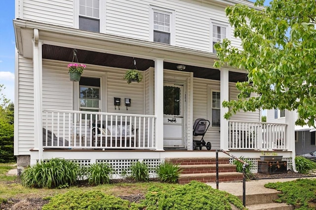 28 Gardner St, Arlington, MA 02474 - view of front of house featuring covered porch