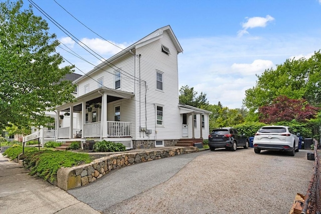 28 Gardner St, Arlington, MA 02474 - view of front of house featuring a porch
