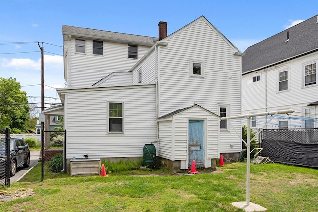 28 Gardner St, Arlington, MA 02474 - rear view of property with a chimney
