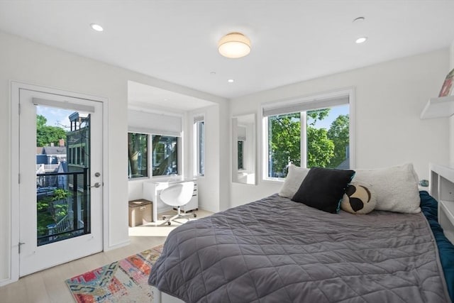 62 Pearl Unit 62, Cambridge, MA 02139 - bedroom featuring access to exterior, wood finished floors, and recessed lighting