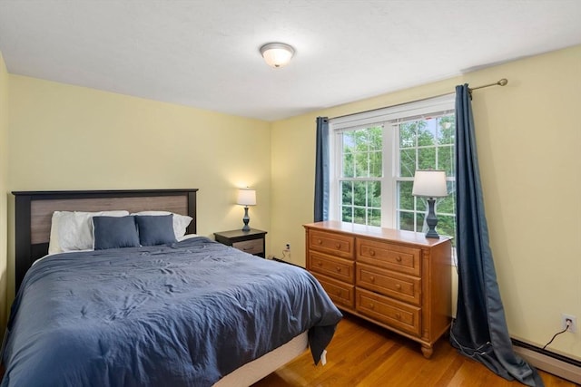 8 Brian Cir, Grafton, MA 01519 - bedroom with a baseboard heating unit and light wood finished floors