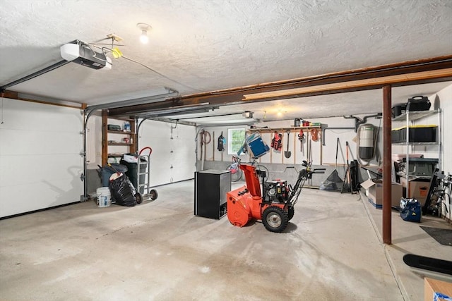 8 Brian Cir, Grafton, MA 01519 - garage featuring a garage door opener and a central vacuum unit
