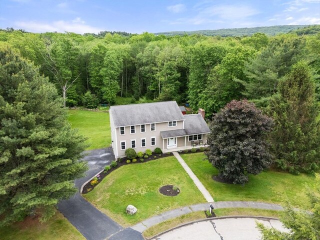 8 Brian Cir, Grafton, MA 01519 - aerial view of property and surrounding area featuring a heavily wooded area