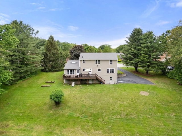 8 Brian Cir, Grafton, MA 01519 - back of house featuring a deck, a lawn, stairway, and a chimney