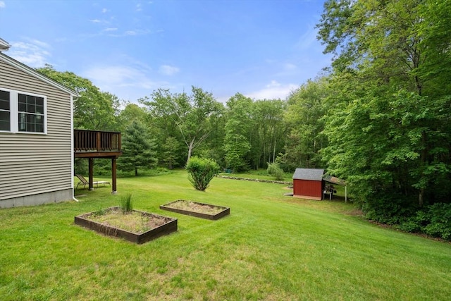 8 Brian Cir, Grafton, MA 01519 - view of green lawn with a vegetable garden and a wooden deck