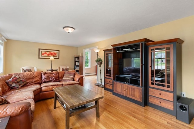 8 Brian Cir, Grafton, MA 01519 - living area with baseboard heating, light wood-style floors, and plenty of natural light