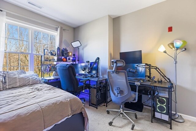 bedroom featuring light colored carpet