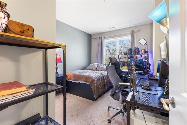 bedroom featuring light colored carpet