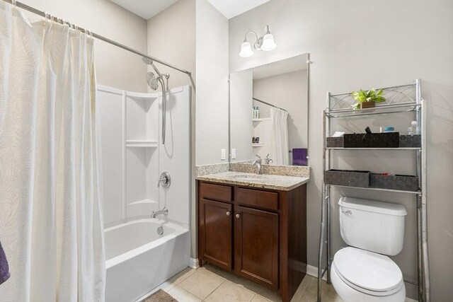 full bathroom with toilet, shower / bath combination with curtain, vanity, and tile patterned floors