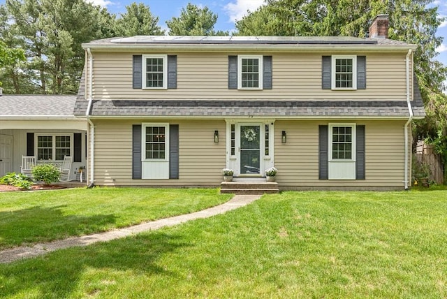 15 Bunny Ln, Brooklyn, CT 06234 - view of front of house featuring a chimney, a front yard, and a shingled roof