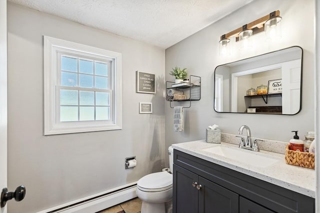 15 Bunny Ln, Brooklyn, CT 06234 - half bath with a baseboard heating unit, vanity, toilet, and a textured ceiling