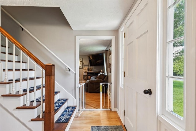 15 Bunny Ln, Brooklyn, CT 06234 - foyer entrance featuring light wood-type flooring, stairway, and a textured ceiling