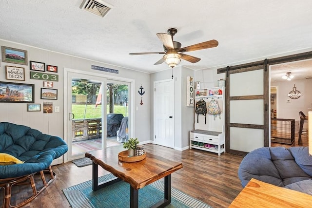 15 Bunny Ln, Brooklyn, CT 06234 - living room with a barn door, ceiling fan, wood finished floors, and baseboards