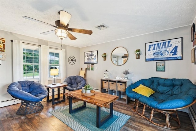 15 Bunny Ln, Brooklyn, CT 06234 - living room with a textured ceiling, wood finished floors, a ceiling fan, a baseboard heating unit, and baseboard heating