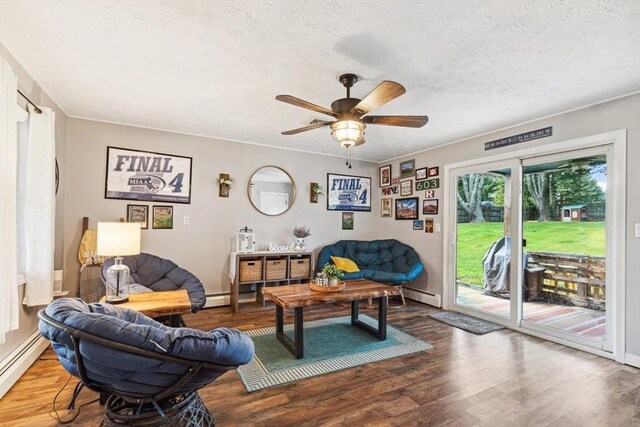 15 Bunny Ln, Brooklyn, CT 06234 - living area with a baseboard heating unit, wood finished floors, ceiling fan, and a textured ceiling
