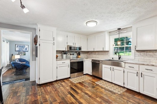 15 Bunny Ln, Brooklyn, CT 06234 - kitchen featuring stainless steel appliances, dark wood-style floors, a sink, white cabinets, and a textured ceiling