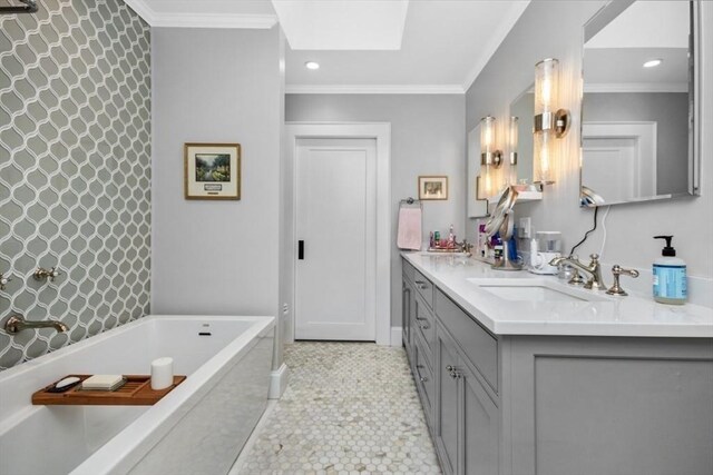 full bathroom with a freestanding bath, double vanity, crown molding, recessed lighting, and a skylight
