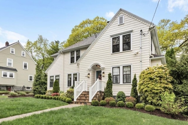 colonial home with a front lawn