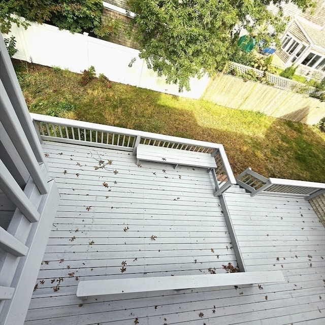 wooden deck with a yard