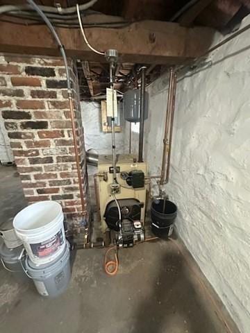 utility room featuring a heating unit