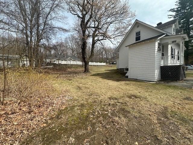 view of yard with covered porch