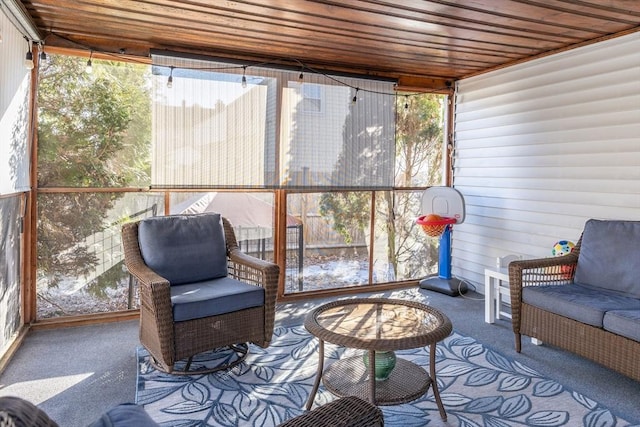 sunroom / solarium featuring wooden ceiling