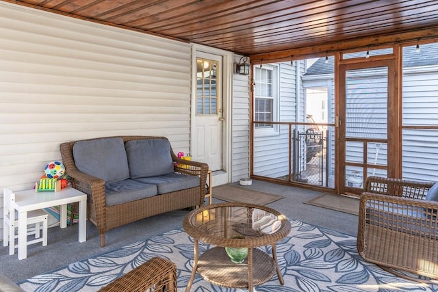 sunroom with wood ceiling