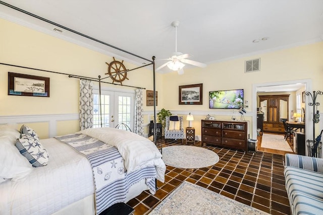 bedroom with french doors and crown molding