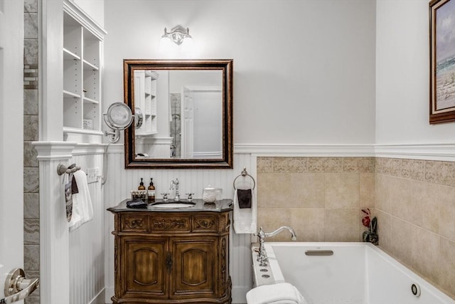bathroom featuring a tub to relax in and vanity