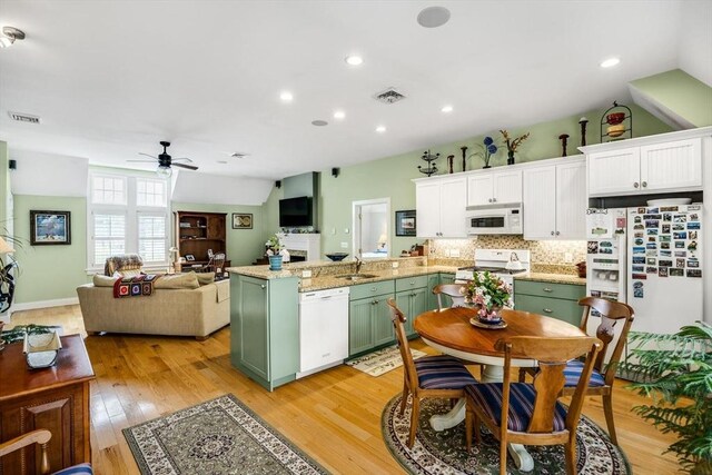 kitchen featuring green cabinetry, white appliances, a ceiling fan, white cabinetry, and a sink