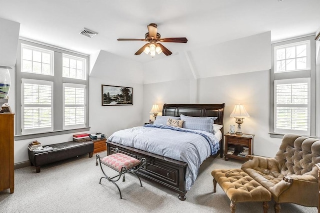carpeted bedroom with lofted ceiling and a ceiling fan