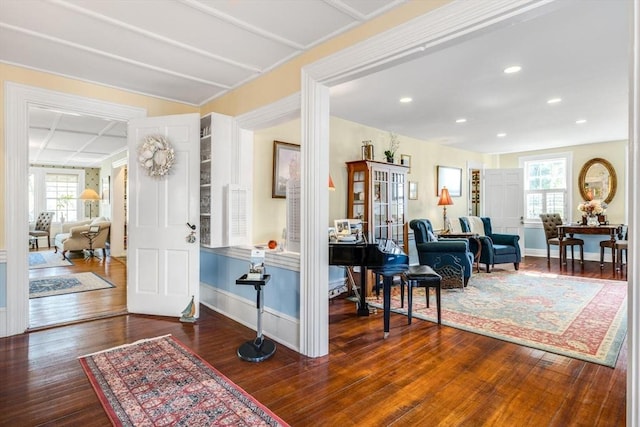 entryway featuring wood finished floors, baseboards, and recessed lighting
