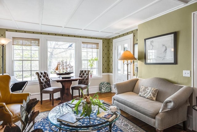 living room featuring wood finished floors, healthy amount of natural light, baseboards, and ornamental molding