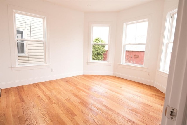 8 Brookside Ave Unit 2, Boston, MA 02130 - unfurnished room featuring wood finished floors, baseboards, and healthy amount of natural light