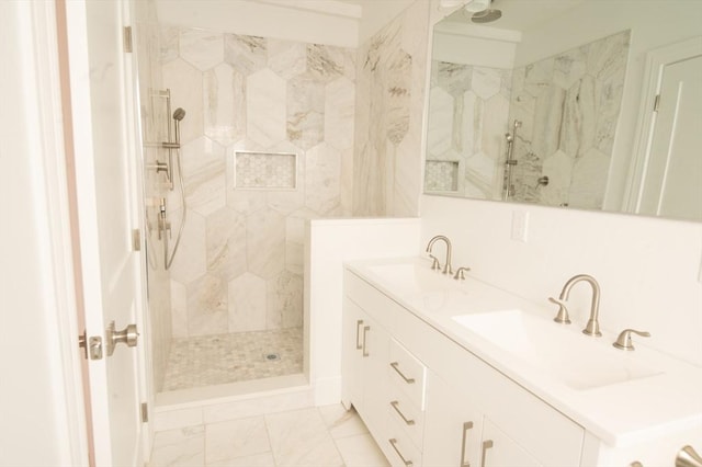8 Brookside Ave Unit 2, Boston, MA 02130 - bathroom with a marble finish shower, double vanity, and marble look tiles