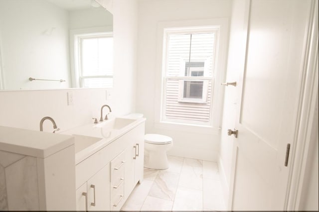 8 Brookside Ave Unit 2, Boston, MA 02130 - full bath featuring marble finish floors, double vanity, and toilet