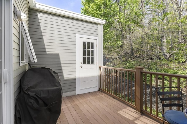 wooden terrace featuring area for grilling