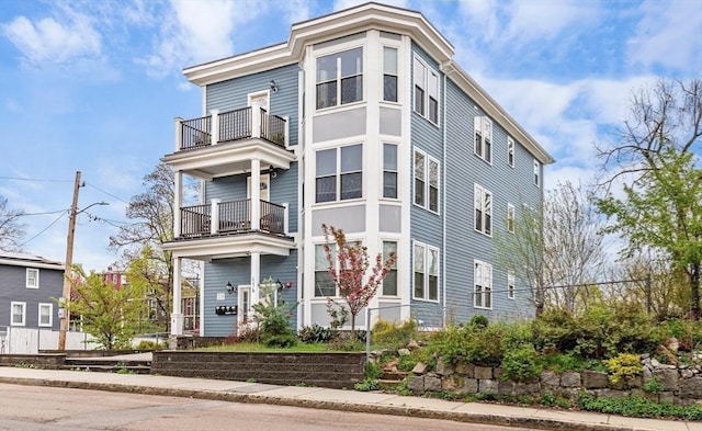 view of front of property with a balcony